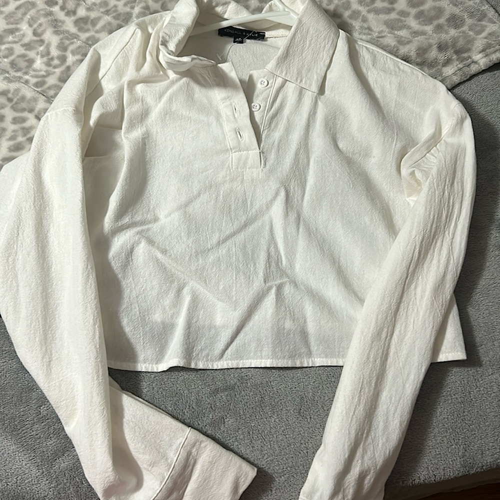 selling this white type of crop top. I bought it from Pacsun.